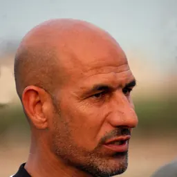 Portrait of Radhi Shenaishil