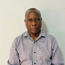 Portrait of Asan Kasingye