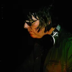 Portrait of Andy Rourke