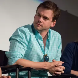 Portrait of Tommy Dewey